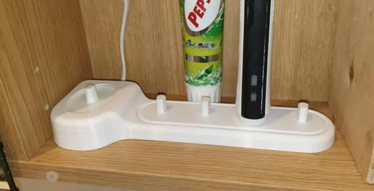 Toothbrush charging dock and storage pegs