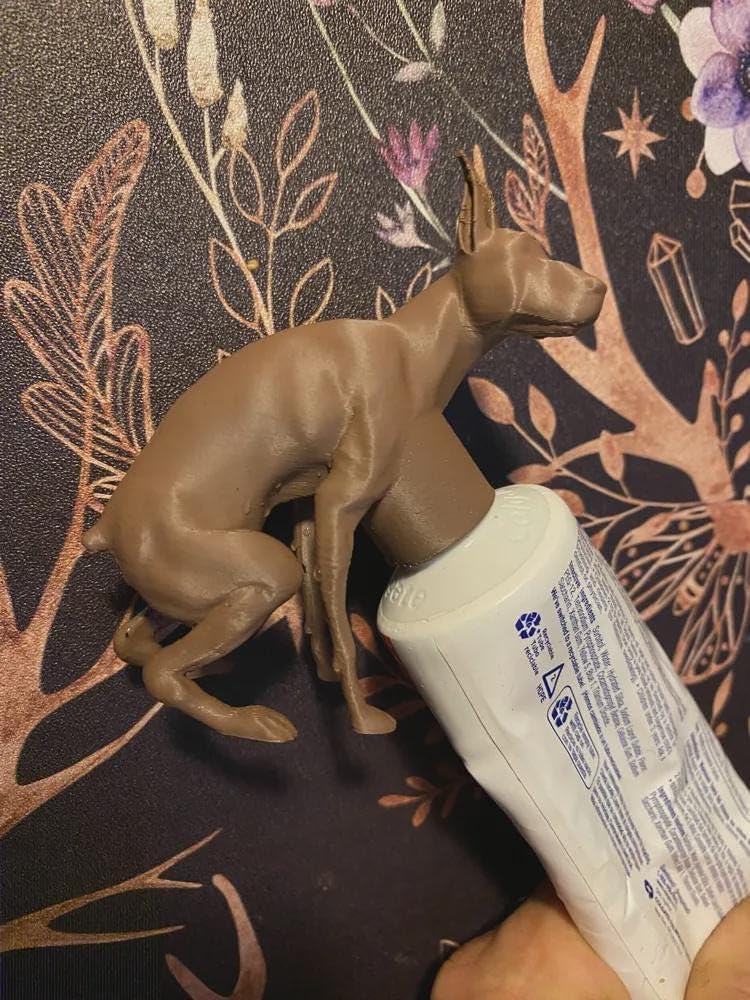Pooping Doberman Toothpaste Cap