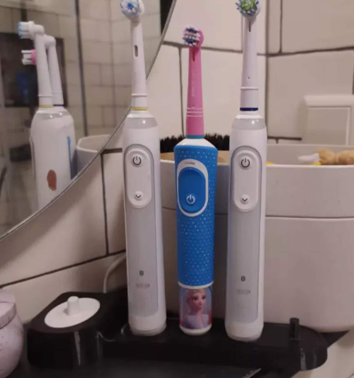 Black Oral-B toothbrush stand with charging dock