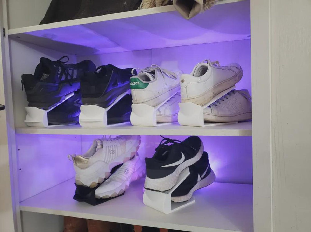 Space-saving pull-tab shoe organizer holding a pair of shoes