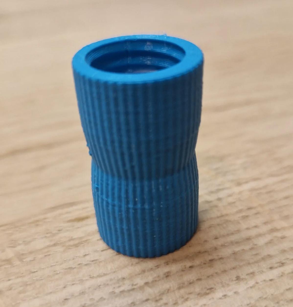 Blue toothpaste transfer adapter close-up