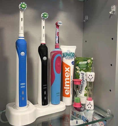 Oral-B toothbrush stand holding three electric toothbrushes