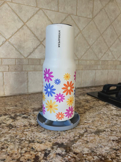 Tumbler drying upside down on a drip tray stand