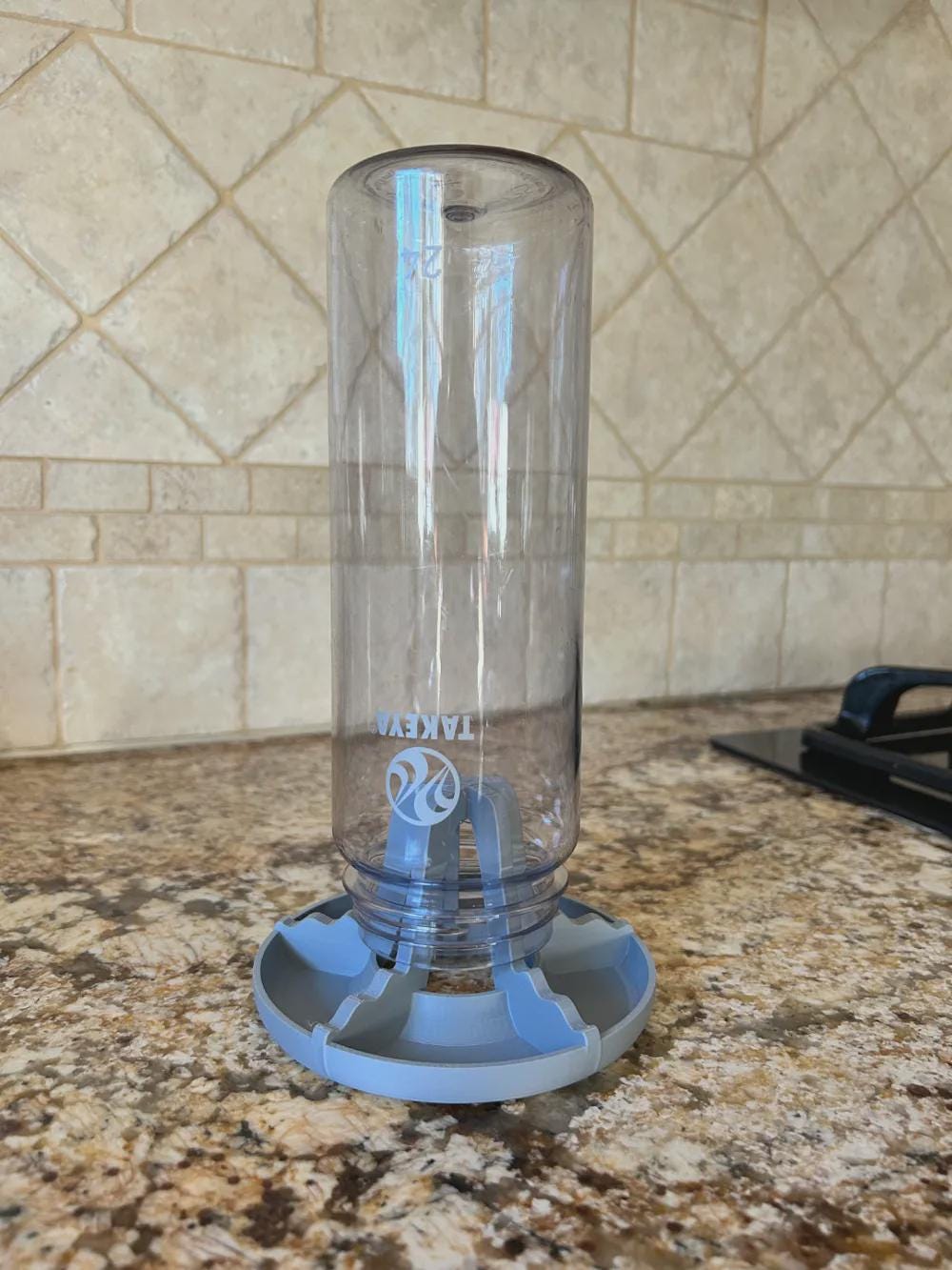 Water bottle drying upside down on the stand