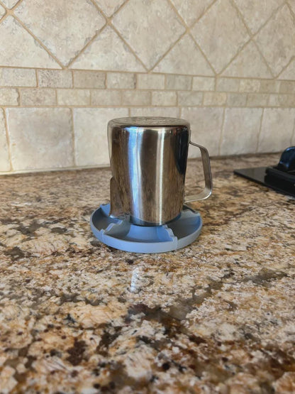 Metal mug drying upside down on the rack