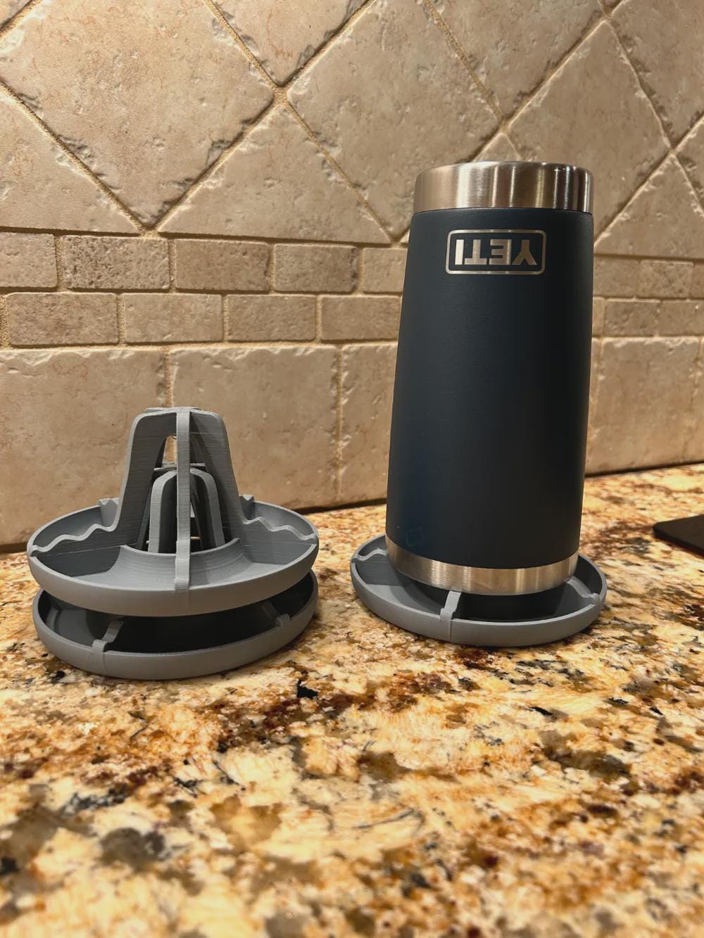Stacked drying racks beside an insulated tumbler
