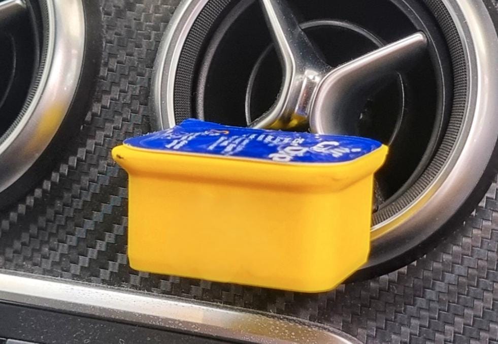 Car vent sauce holder with a fast food dipping cup