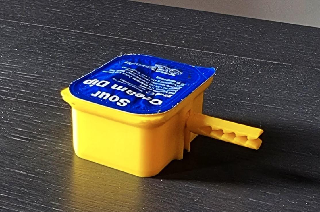 To-go sauce holder installed on a vehicle air vent