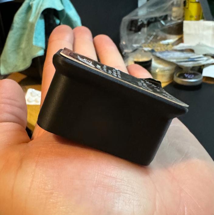 Fast food sauce cup secured in a car vent holder