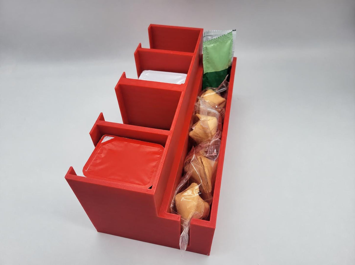 Condiment caddy filled with takeout sauce packets