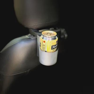 Car headrest cup holder installed behind a vehicle seat